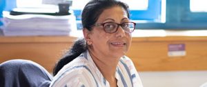a woman sitting at her desk at work